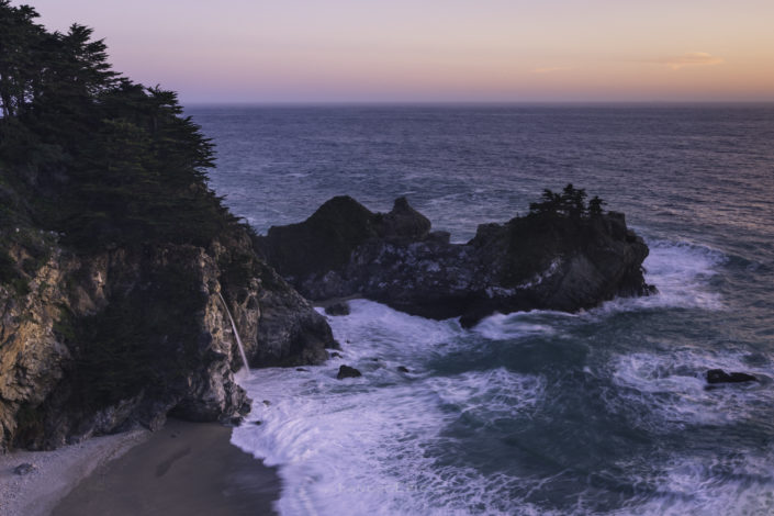 Photo of a sunset at McWay Falls, Big Sur, USA. Buy a canvas, framed or acrylic fine art print.
