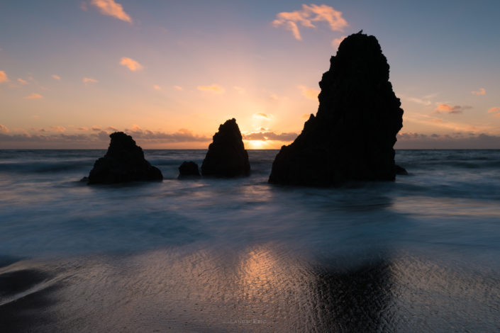 Photo sunset over rocks at the Rodeo Beach near San Francisco, California. Buy a canvas, framed or acrylic fine art print.