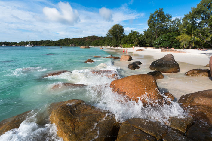 Photo of a beach with white sand and rocks in Seychelles. Buy a canvas, framed or acrylic fine art print.
