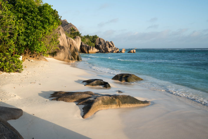 Photo of a golden hour at Anse Source d'Argent, famouse beach on La Digue, Seychelles. Buy a canvas, framed or acrylic fine art print.