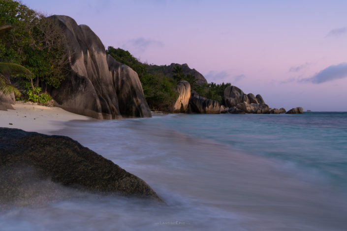 Photo of sunset at Anse Source d'Argent, famouse beach on La Digue, Seychelles. Buy a canvas, framed or acrylic fine art print.
