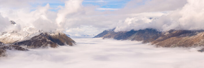 Beautiful panorama of Swiss Alps above low clouds visible from Klein Matterhorn, Switzerland