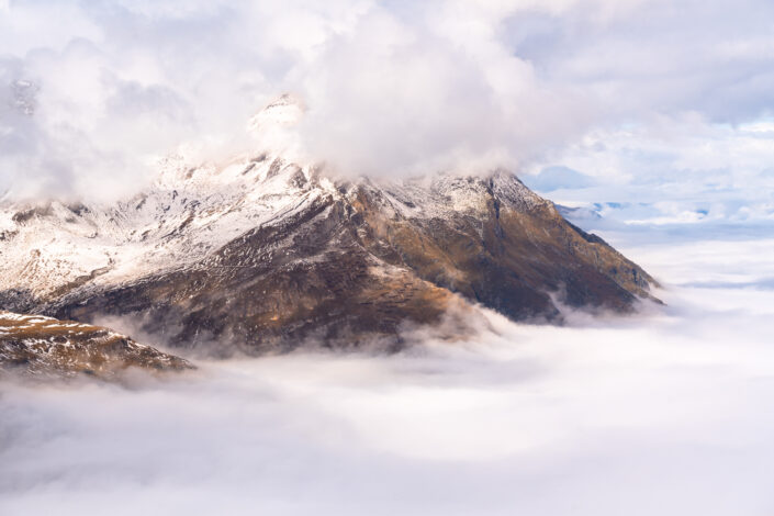 Swiss Alps visible above clouds