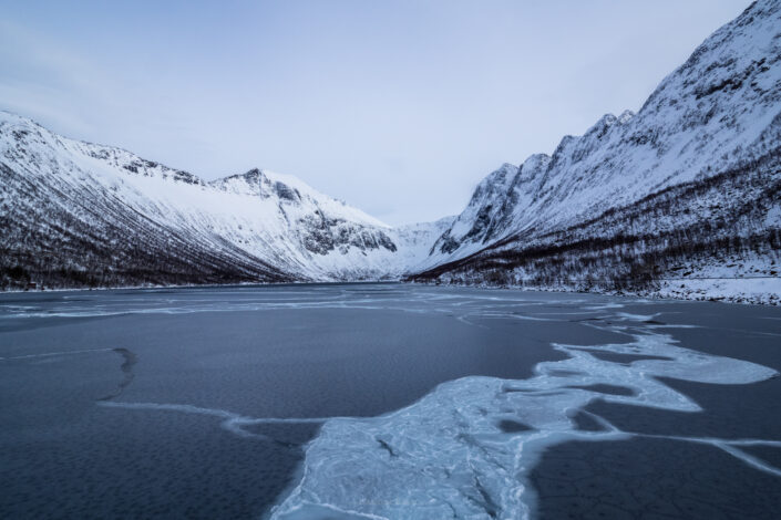 Frozen winter landscape in one of Norwegian Fjords. Buy a canvas, framed or acrylic fine art print.