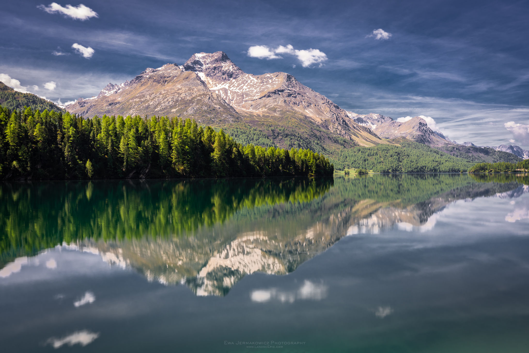 Beautiful photo of mountain reflection in a lake Silsersee in Swiss Alps