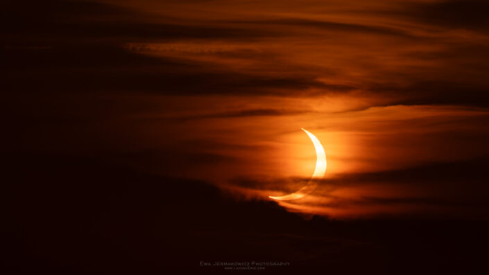Partial Phase of the Total Solar Eclipse 2026 in the clouds visible from Mallorca Spain
