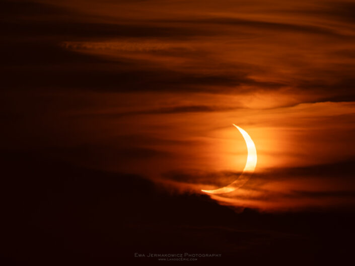 Partial Phase of the Total Solar Eclipse 2026 in the clouds visible from Mallorca Spain